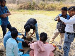 Handhold in feed preperation for rearing pond